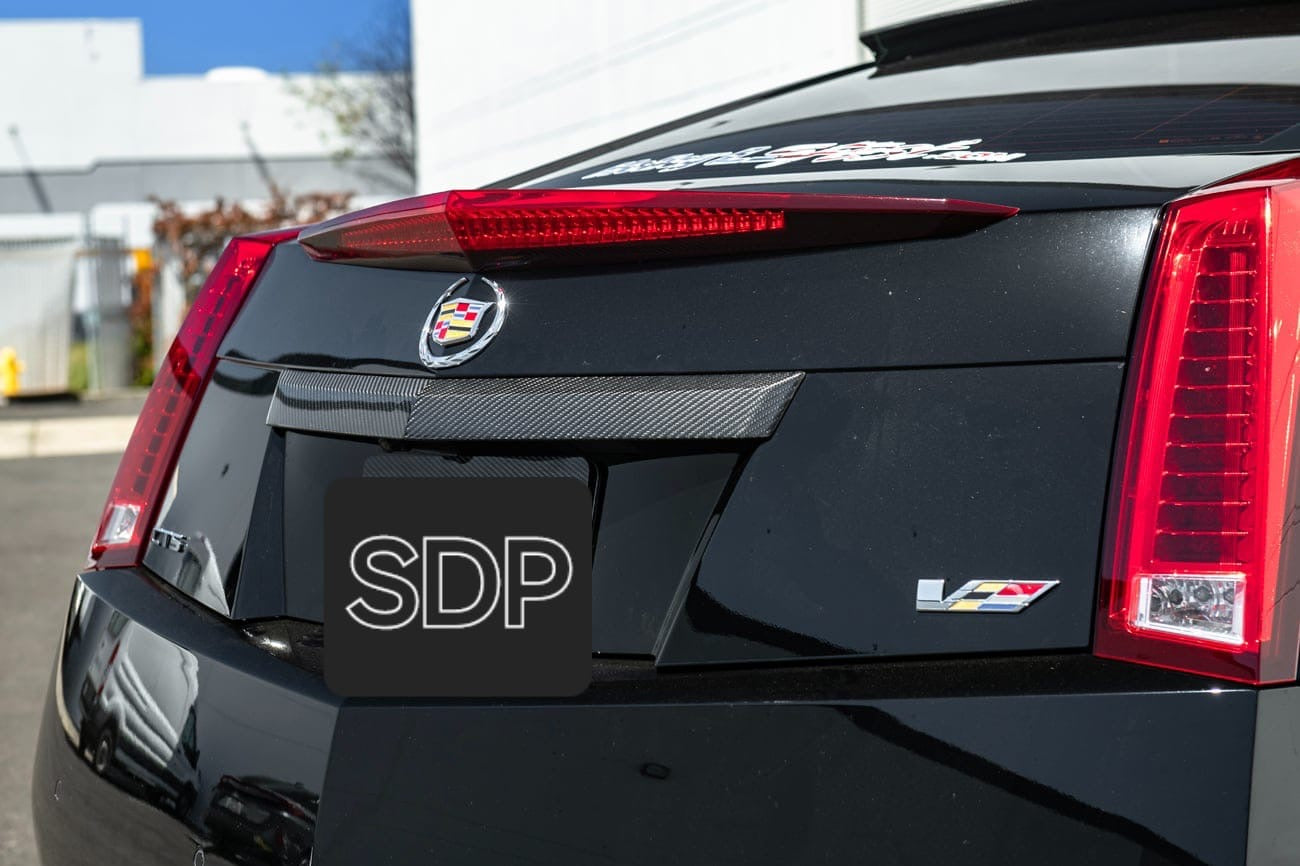 2009-15 CADILLAC CTS-V V2 COUPE | CARBON FIBER REAR TRUNK DECKLID APPLIQUÉ INSERT-FOR MODELS EQUIPPED WITH SINGLE LENS CAMERA